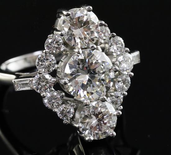 An attractive 18ct white gold and diamond cluster elliptical shaped ring, size M/N.